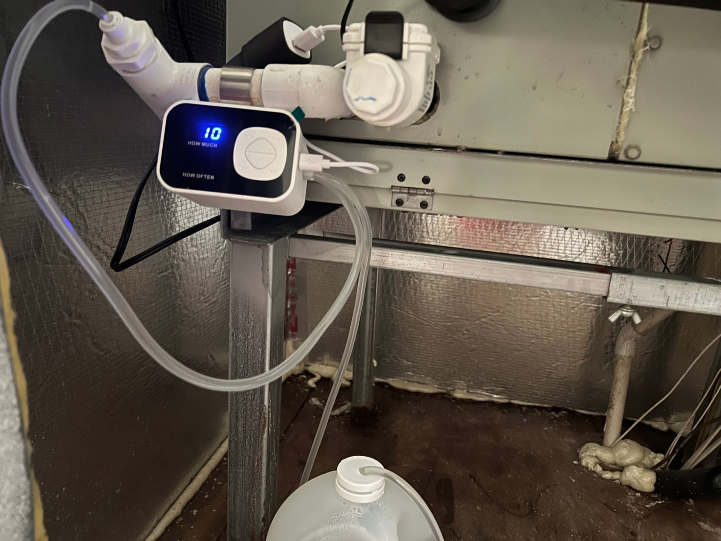 AC Drain FLO in operation, injecting vinegar into HVAC drain line